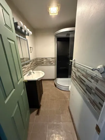 a bathroom with a sink and mirror