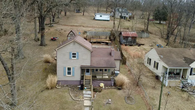 a aerial view of a house with a yard
