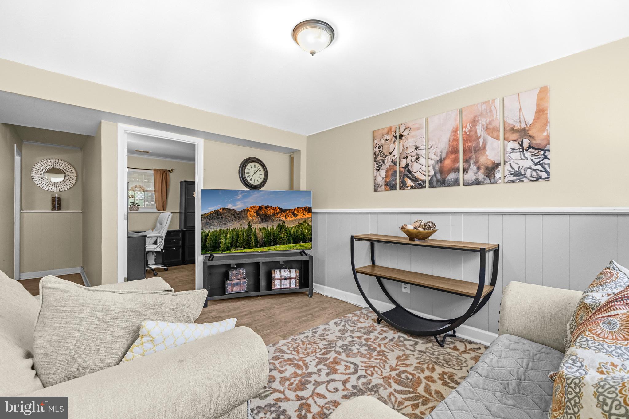 236 Inlet Drive Pasadena, MD 21122 - Photo 22 of 33 a living room with furniture a rug and white walls