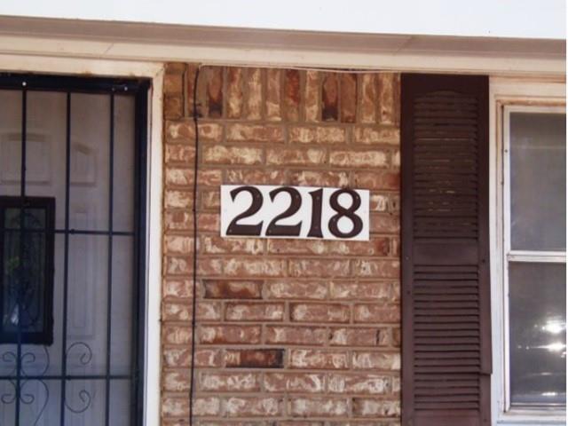 2218 Joliet Street Plainview, TX 79072 - Photo 2 of 9 a sign that is on the wall of building