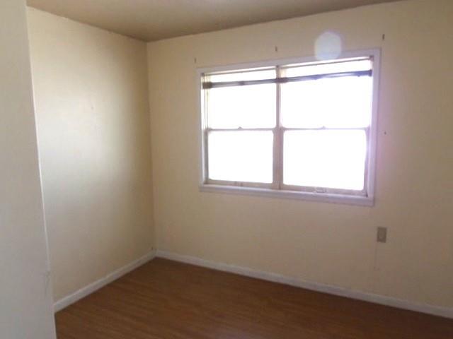 2218 Joliet Street Plainview, TX 79072 - Photo 6 of 9 an empty room with a window