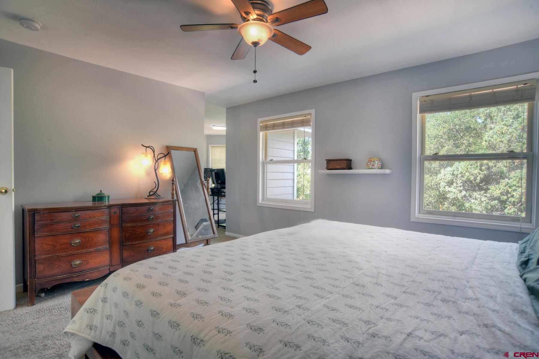 1172 Ridge Road Durango, CO 81303 - Photo 26 of 43 a bedroom with a bed dresser and a window