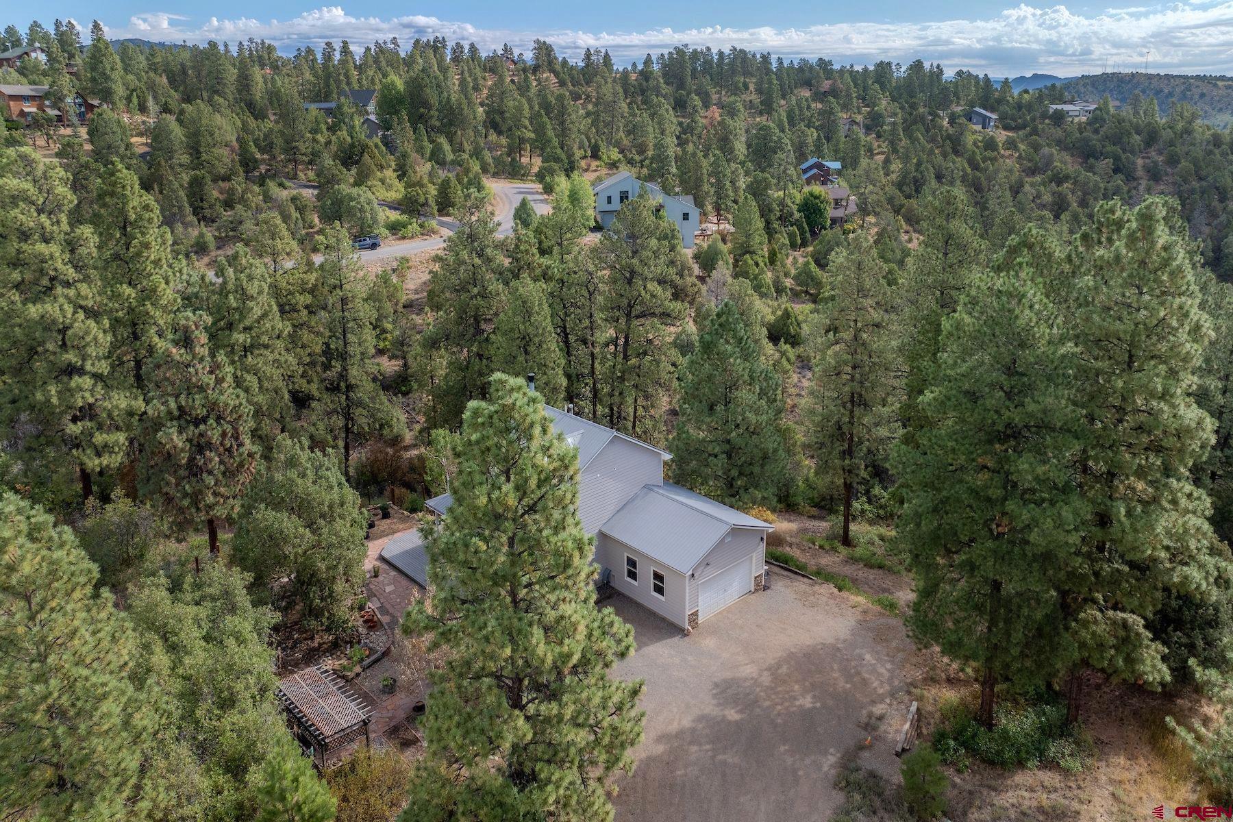 1172 Ridge Road Durango, CO 81303 - Photo 4 of 43 an aerial view of a house with mountain view