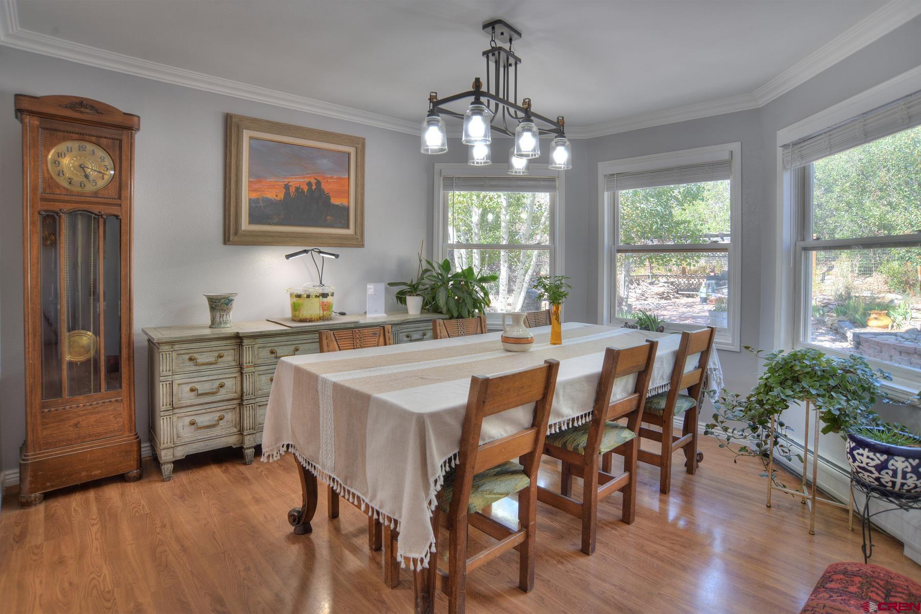 1172 Ridge Road Durango, CO 81303 - Photo 9 of 43 a view of a dining room with furniture window and wooden floor