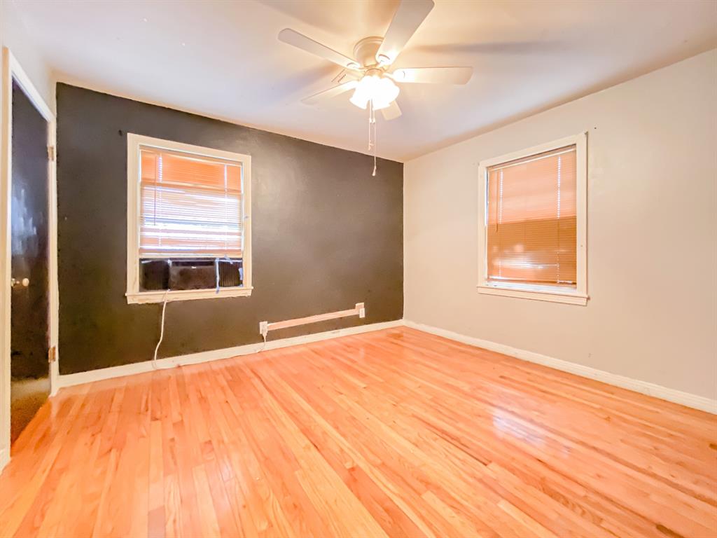 211 Paloma Street Winters, TX 79567 - Photo 12 of 19 a bedroom with a bed and a window