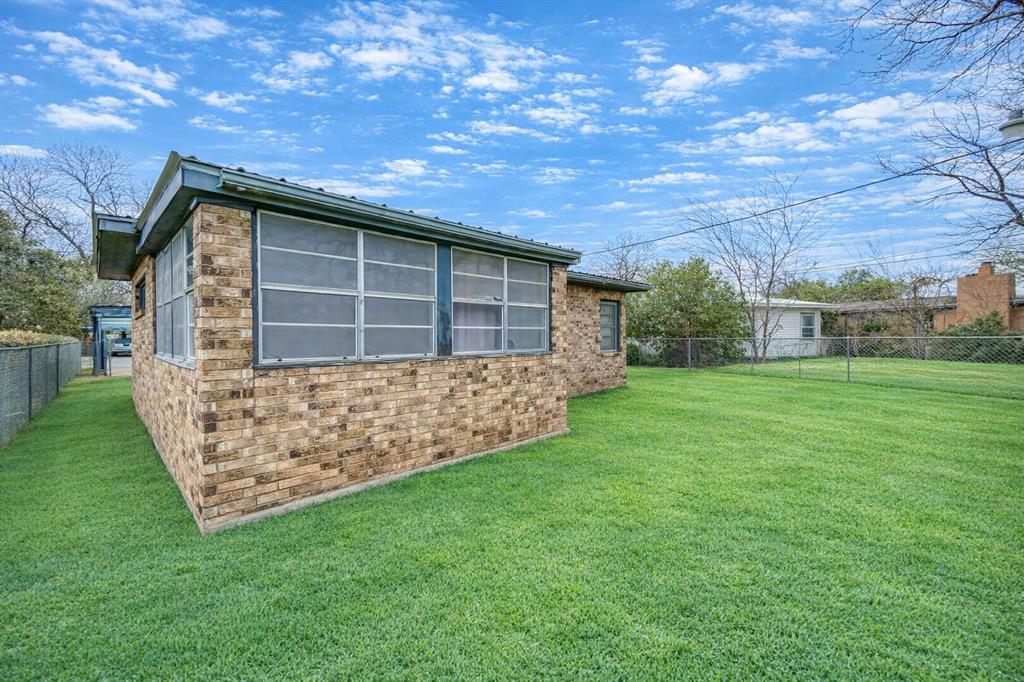 211 Paloma Street Winters, TX 79567 - Photo 19 of 19 a house with garden in front of it