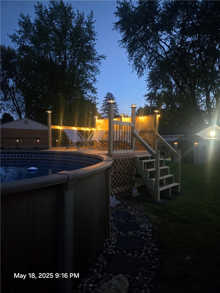 321 Liberty Street Eaton, OH 45320 - Photo 16 of 34 This inviting backyard oasis features a spacious deck and sparkling pool, perfect for outdoor enjoyment.