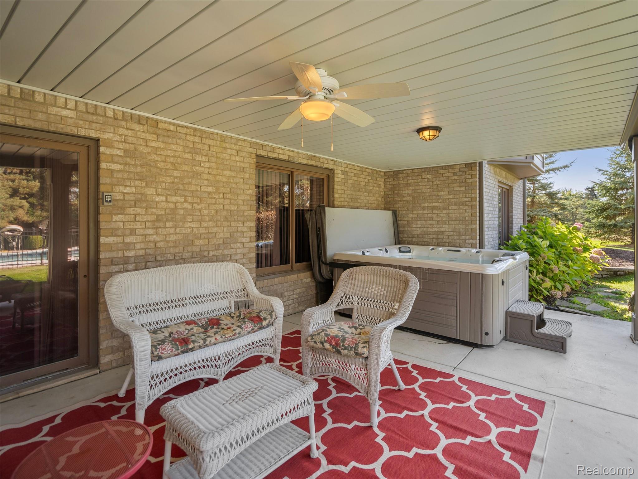 5724 Murfield Drive Rochester, MI 48306 - Photo 8 of 99 View of patio featuring ceiling fan and a hot tub