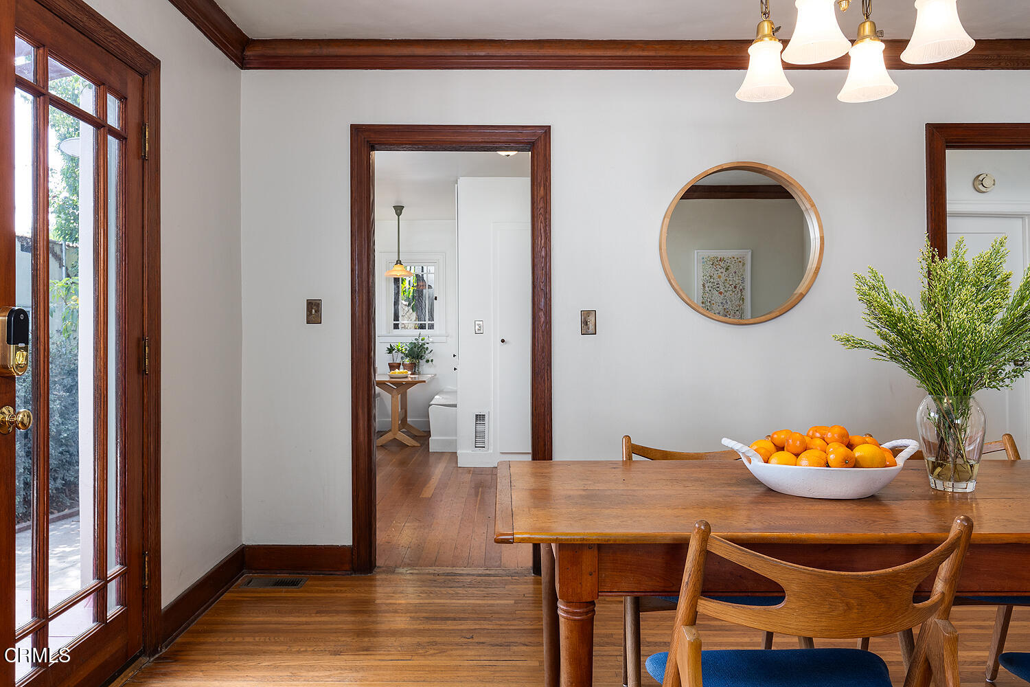 546 Douglas Street Pasadena, CA 91104 - Photo 11 of 36 a dining room with furniture a potted plant and wooden floor