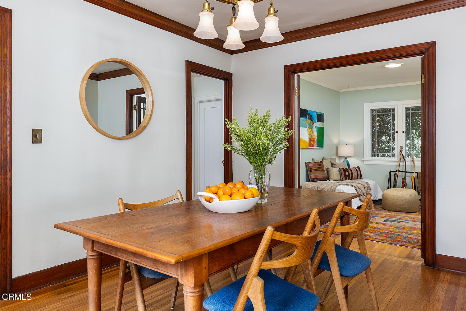 546 Douglas Street Pasadena, CA 91104 - Photo 12 of 36 a dining room with furniture potted plants and wooden floor