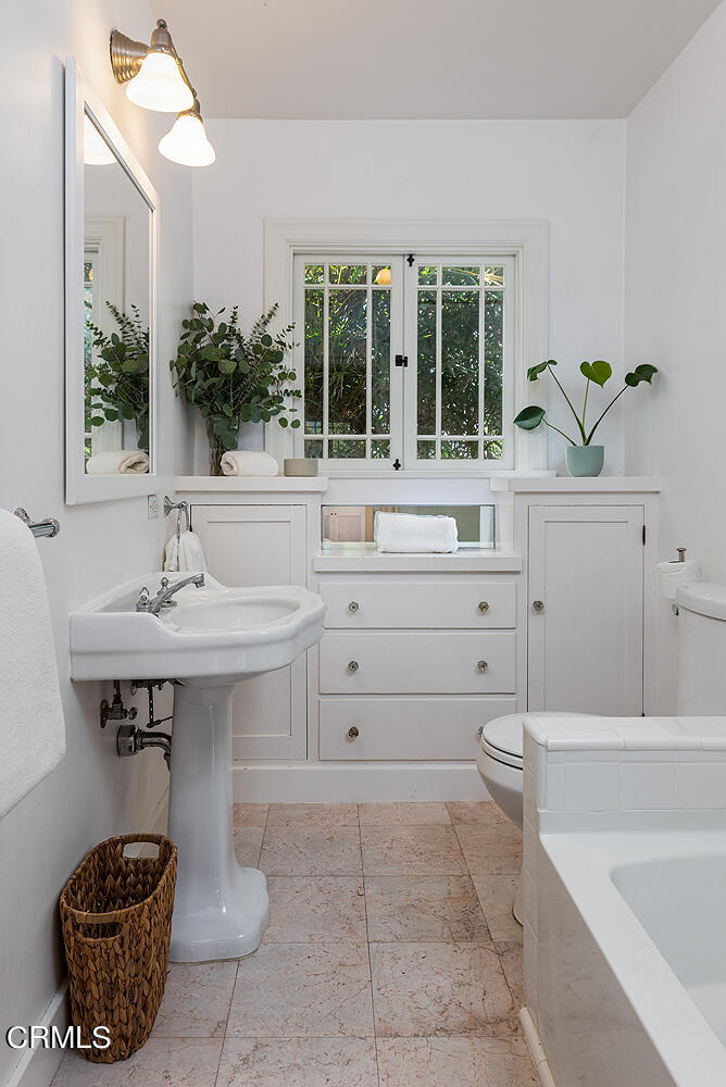 546 Douglas Street Pasadena, CA 91104 - Photo 21 of 36 a bathroom with a sink and a mirror