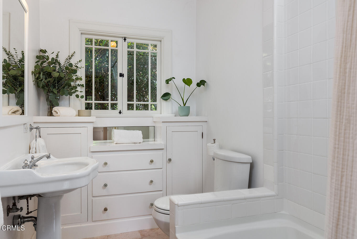 546 Douglas Street Pasadena, CA 91104 - Photo 22 of 36 a bathroom with a sink a toilet and a window