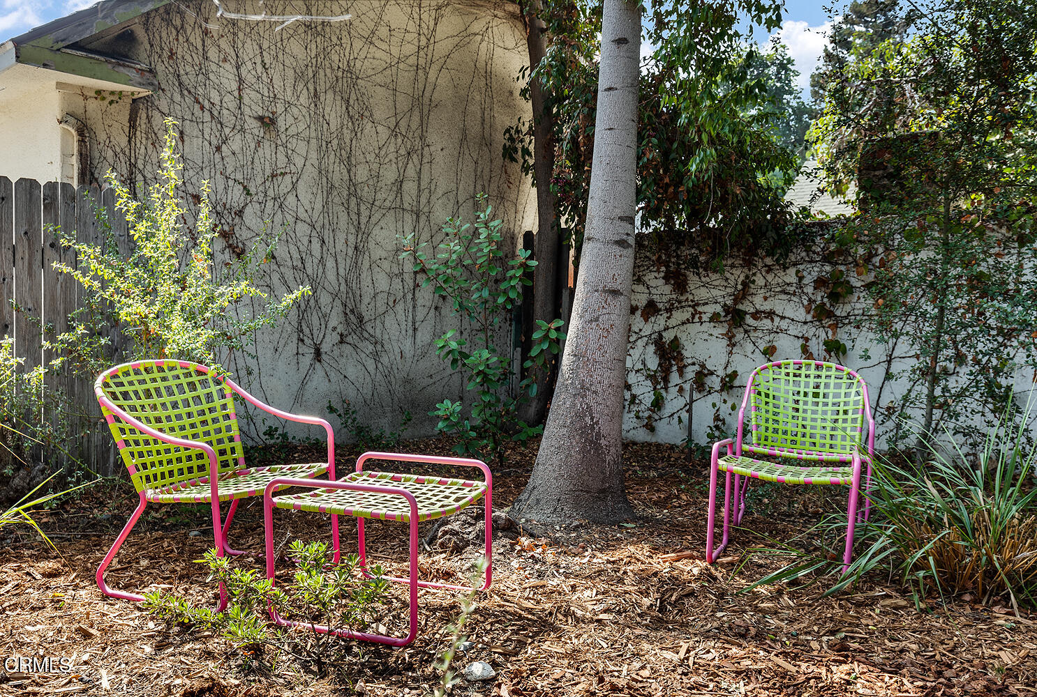 546 Douglas Street Pasadena, CA 91104 - Photo 30 of 36 a table and chairs in a garden