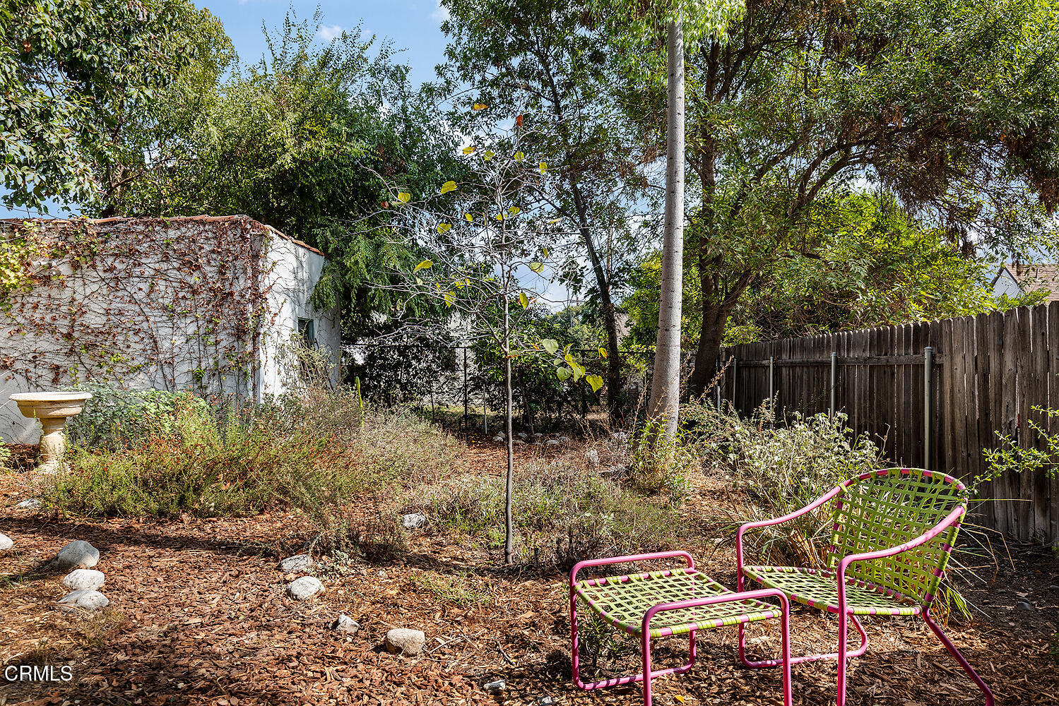 546 Douglas Street Pasadena, CA 91104 - Photo 32 of 36 a view of a chairs and table in backyard