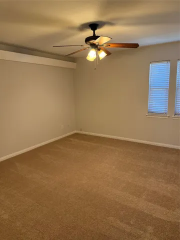 a view of a room with a hanging light