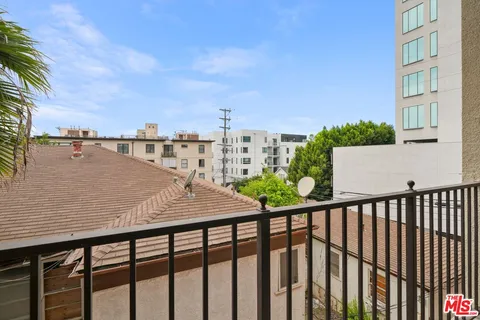 a view of a balcony with an ocean view