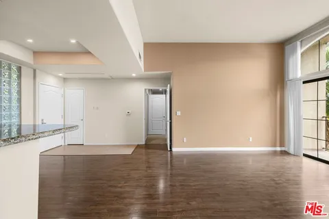 a view of a livingroom with wooden floor