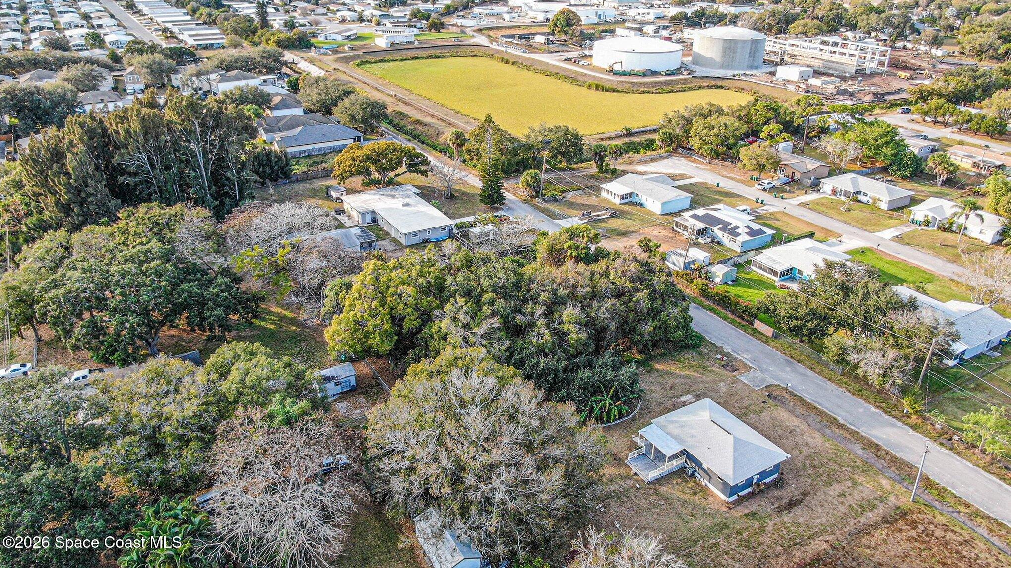 1 Irene Street Melbourne, FL 32904 - Photo 3 of 17 an aerial view of residential houses with outdoor space and swimming pool