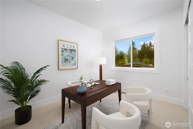 a living room with furniture potted plant and a lamp