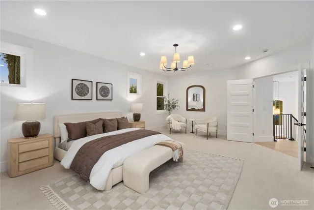 a spacious bedroom with a bed and ceiling fan