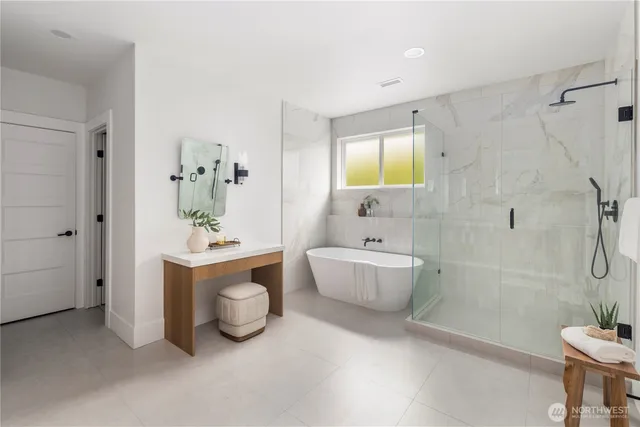 a bathroom with a toilet a sink and bathtub