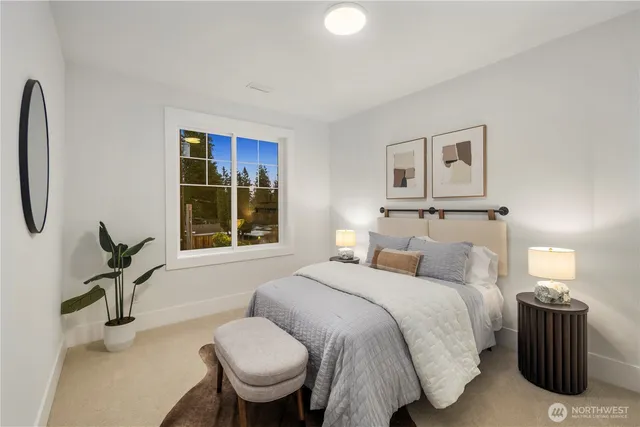 a bedroom with a bed and a couch