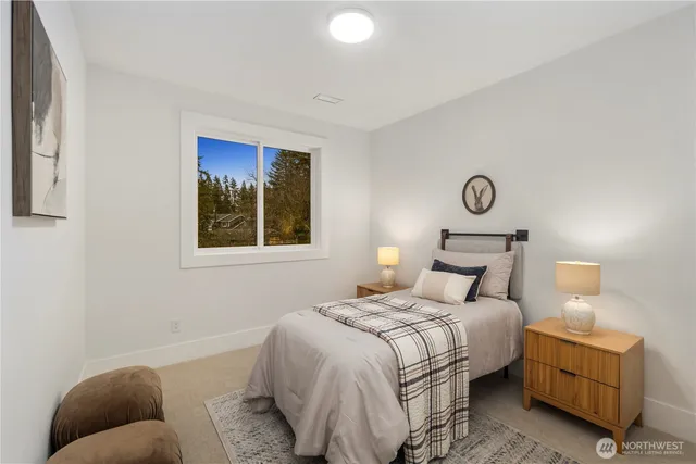 a bedroom with bed and window