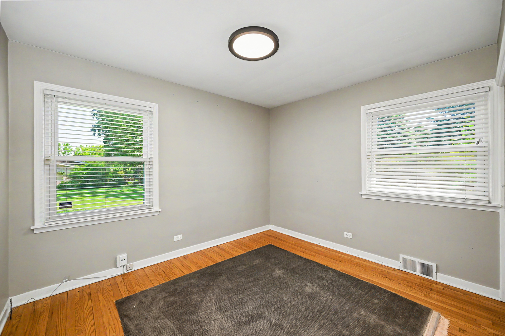 325 South Lambert Road Glen Ellyn, IL 60137 - Photo 21 of 32 a view of a room with wooden floor and windows