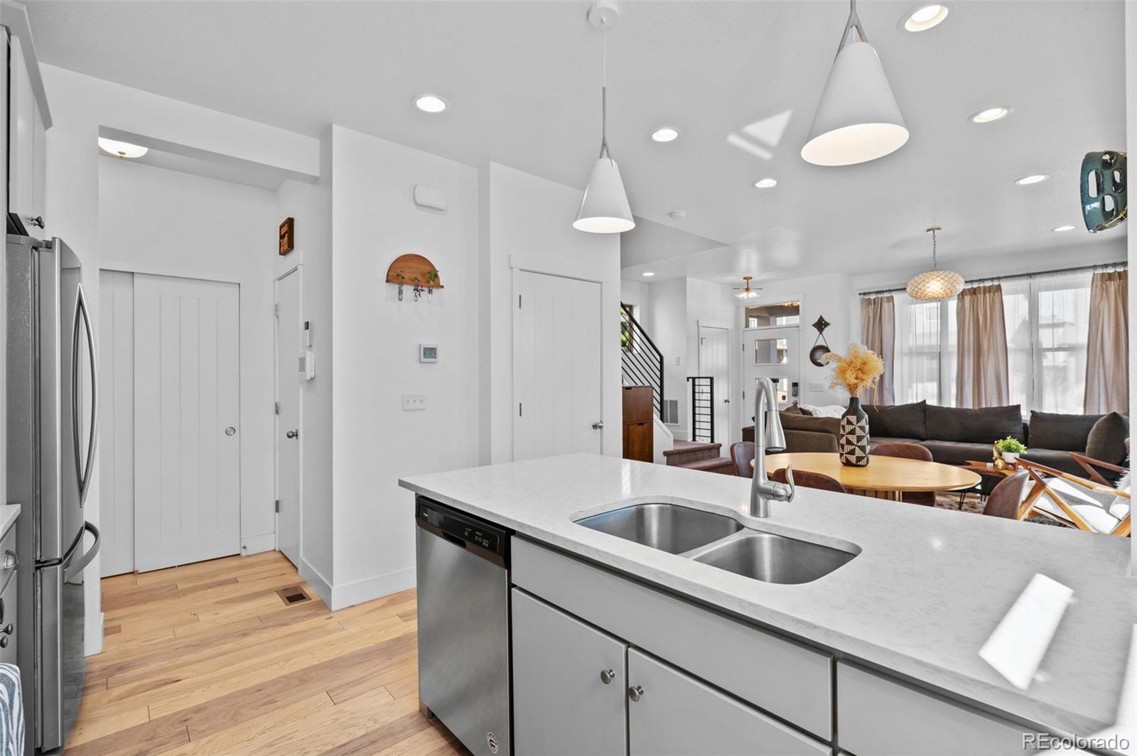 6817 Clay Street Denver, CO 80221 - Photo 12 of 41 a view of a kitchen with a sink and chandelier