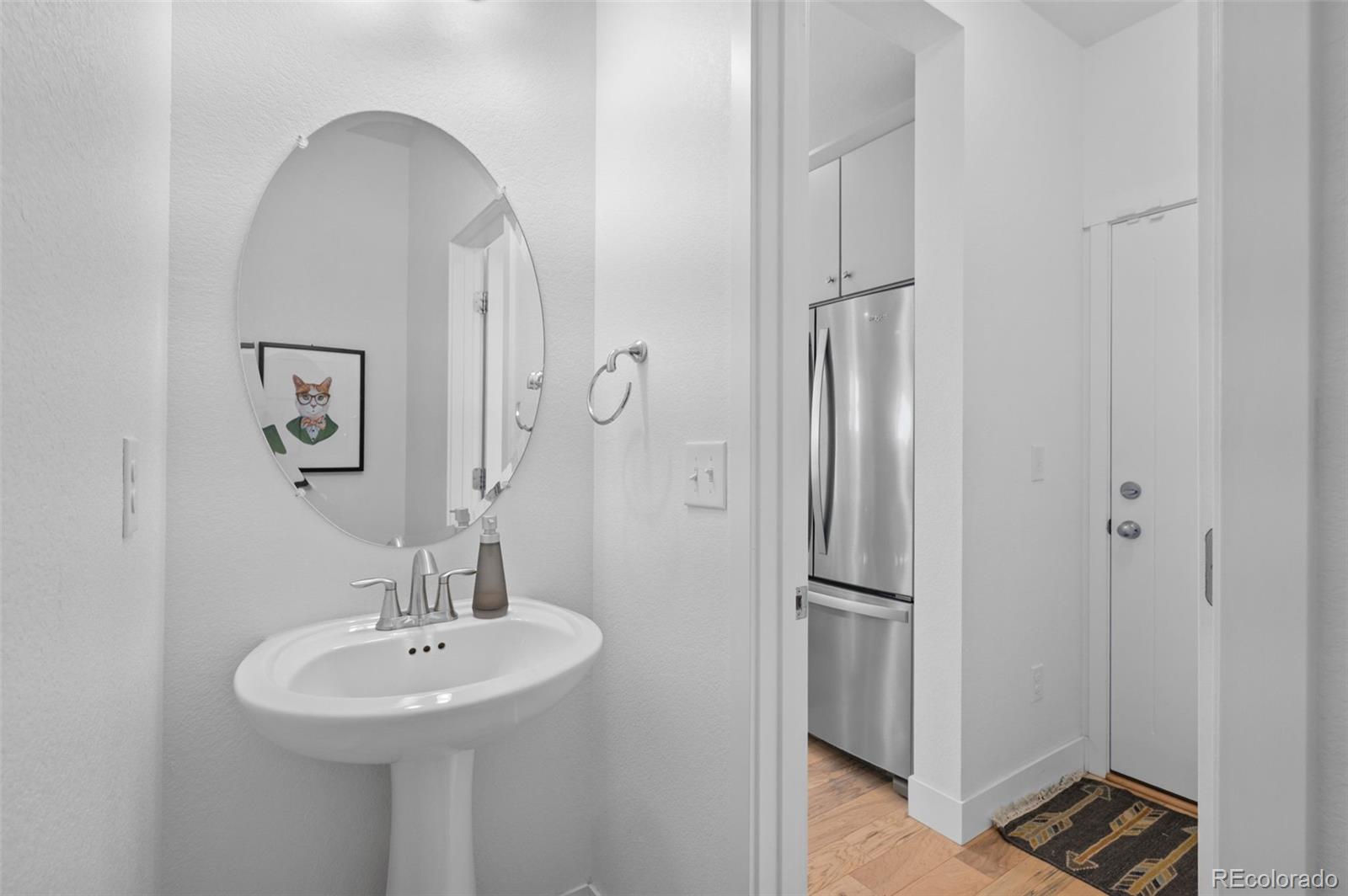 6817 Clay Street Denver, CO 80221 - Photo 13 of 41 a bathroom with a sink and a mirror