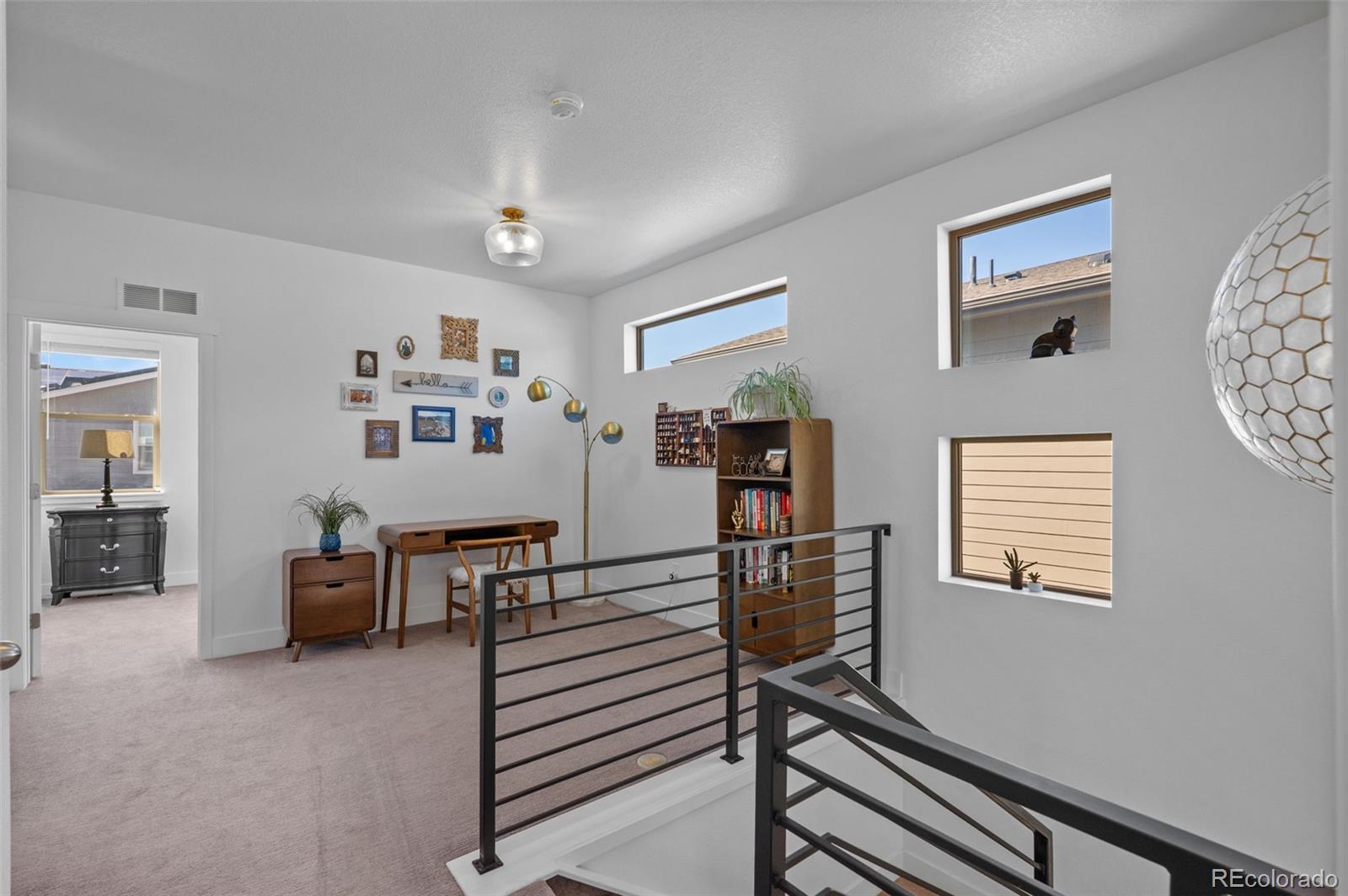 6817 Clay Street Denver, CO 80221 - Photo 19 of 41 a view of a livingroom with furniture workspace and a window