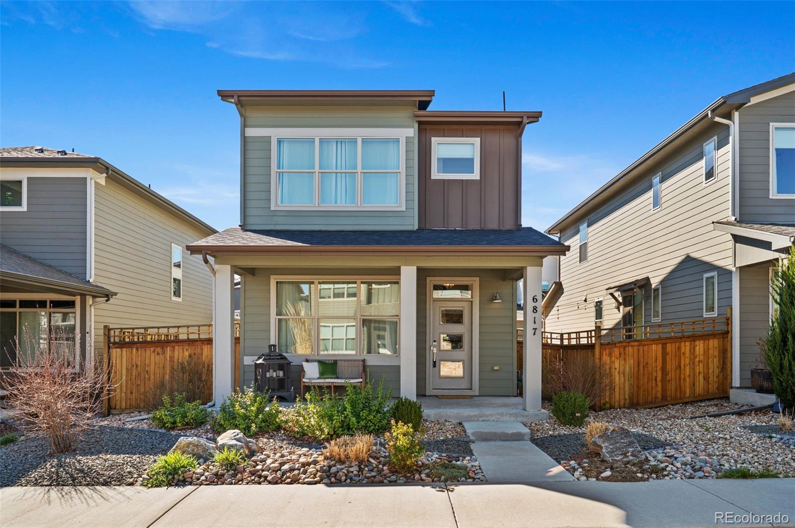 6817 Clay Street Denver, CO 80221 - Photo 2 of 41 a front view of a house with garden