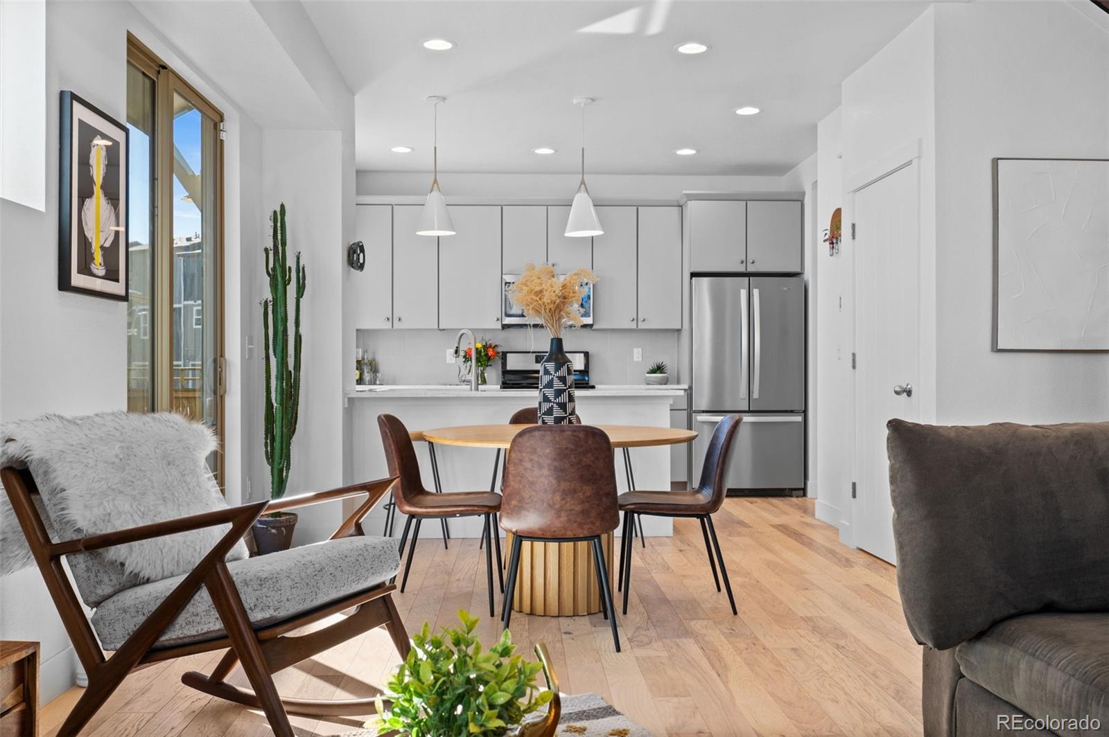 6817 Clay Street Denver, CO 80221 - Photo 8 of 41 a view of a dining room with furniture and wooden floor