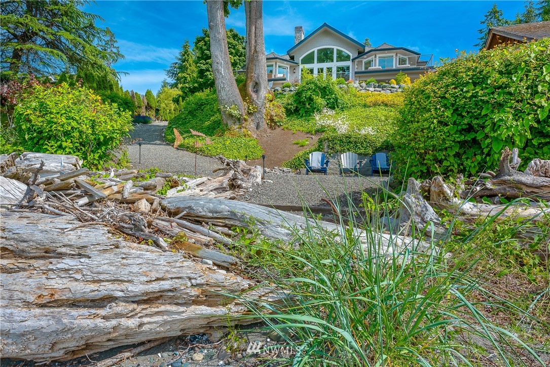 8745 Oertel Drive Blaine, WA 98230 - Photo 1 of 40 a view of a garden with a house in the background