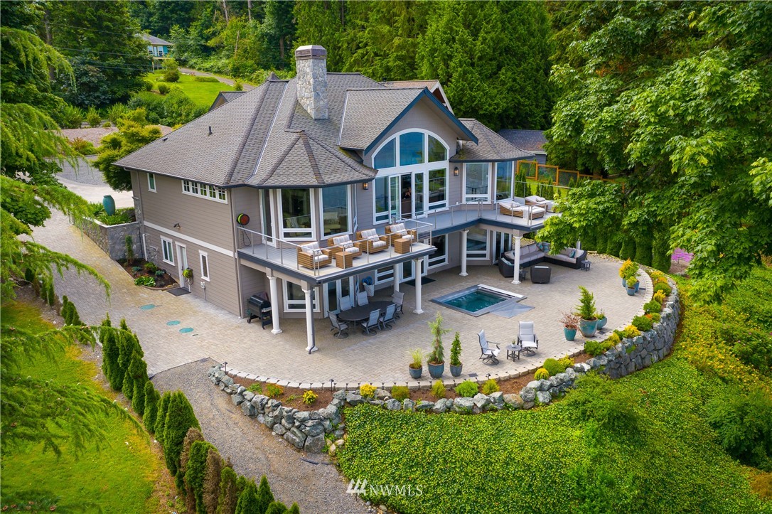 8745 Oertel Drive Blaine, WA 98230 - Photo 2 of 40 an aerial view of a house with table and chairs under an umbrella