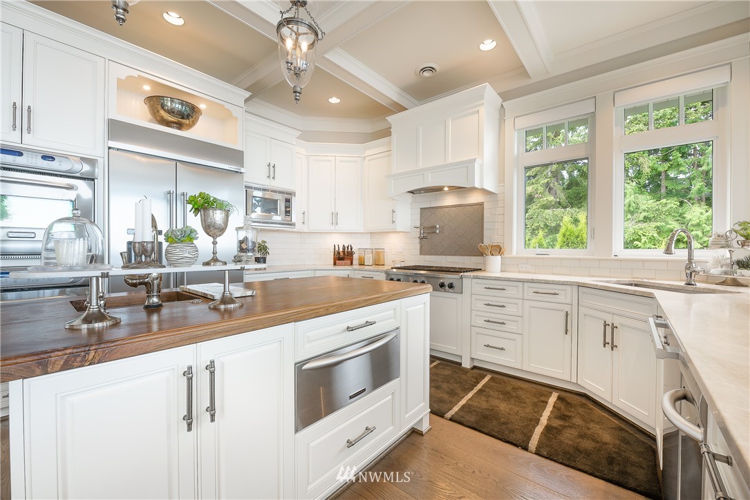 8745 Oertel Drive Blaine, WA 98230 - Photo 12 of 40 a kitchen with a stove a sink and a window