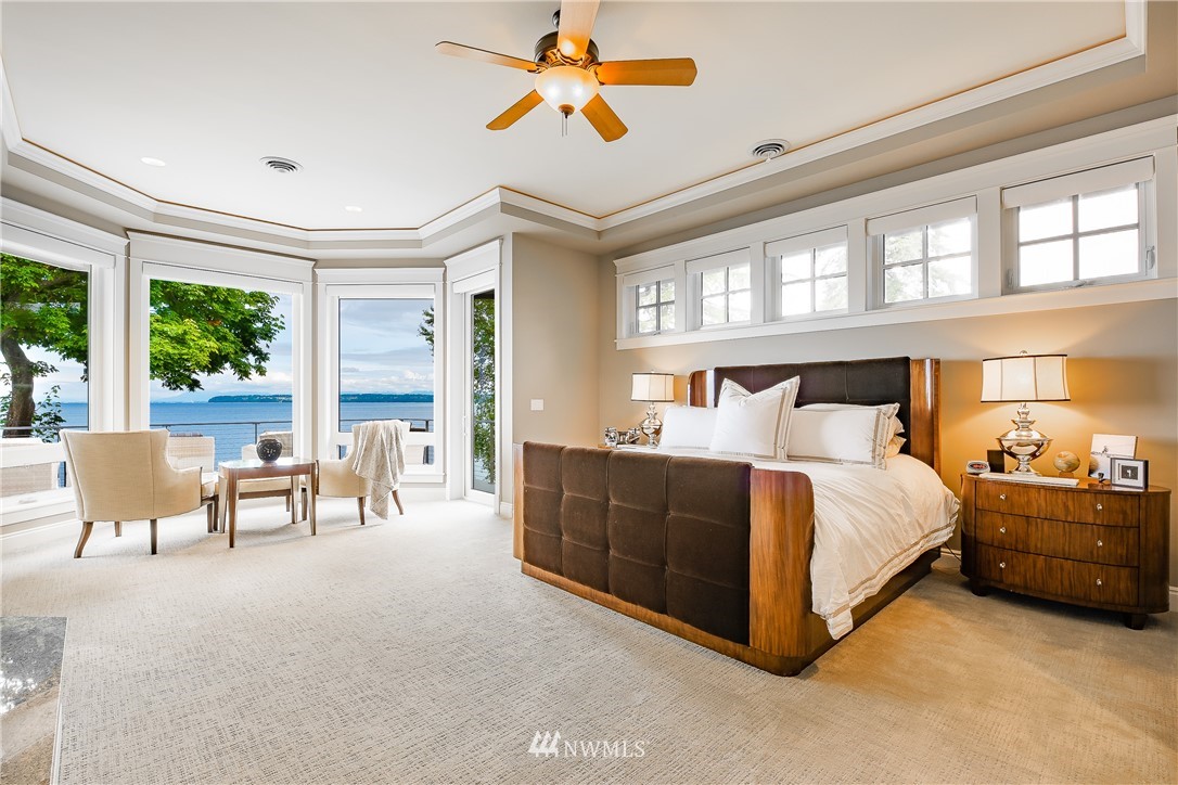 8745 Oertel Drive Blaine, WA 98230 - Photo 14 of 40 a bedroom with a bed and a chandelier