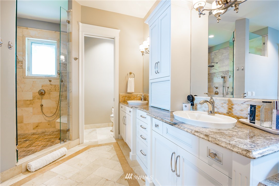 8745 Oertel Drive Blaine, WA 98230 - Photo 17 of 40 a spacious bathroom with a granite countertop sink mirror and shower