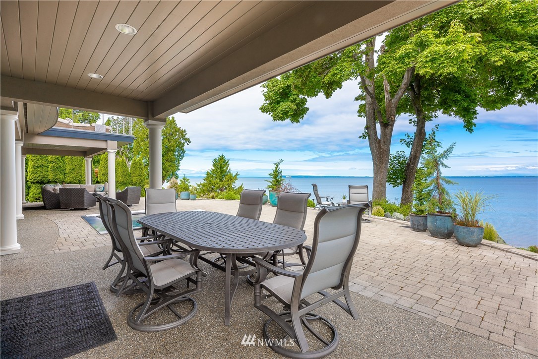 8745 Oertel Drive Blaine, WA 98230 - Photo 3 of 40 a view of a patio with a table chairs and a backyard