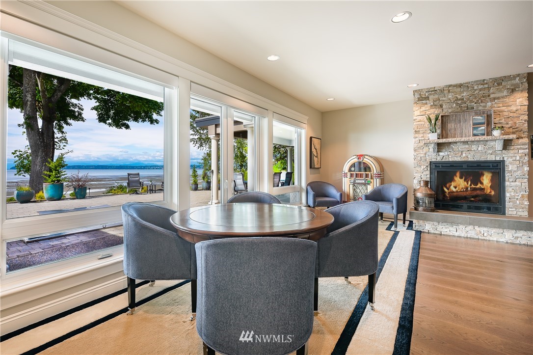 8745 Oertel Drive Blaine, WA 98230 - Photo 26 of 40 a living room with fireplace furniture and a large window
