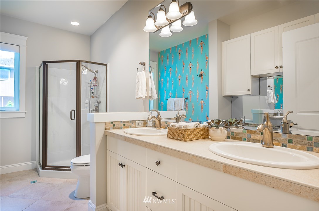 8745 Oertel Drive Blaine, WA 98230 - Photo 28 of 40 a bathroom with a double vanity sink and a mirror