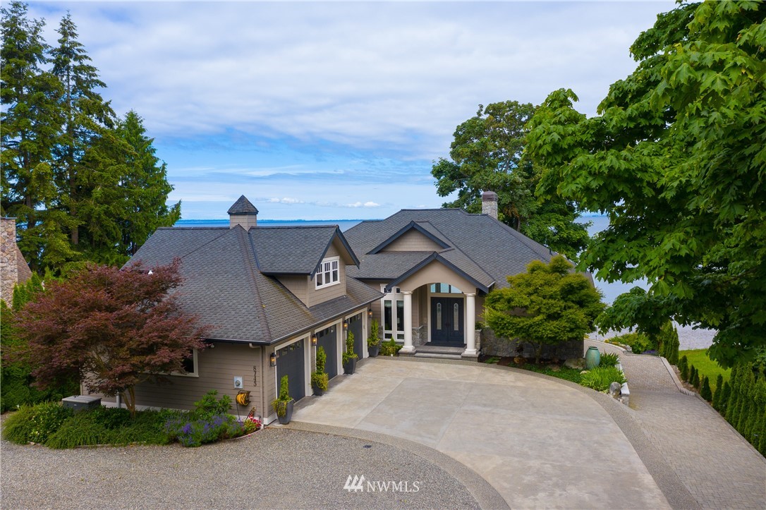 8745 Oertel Drive Blaine, WA 98230 - Photo 4 of 40 a front view of a house with a garden