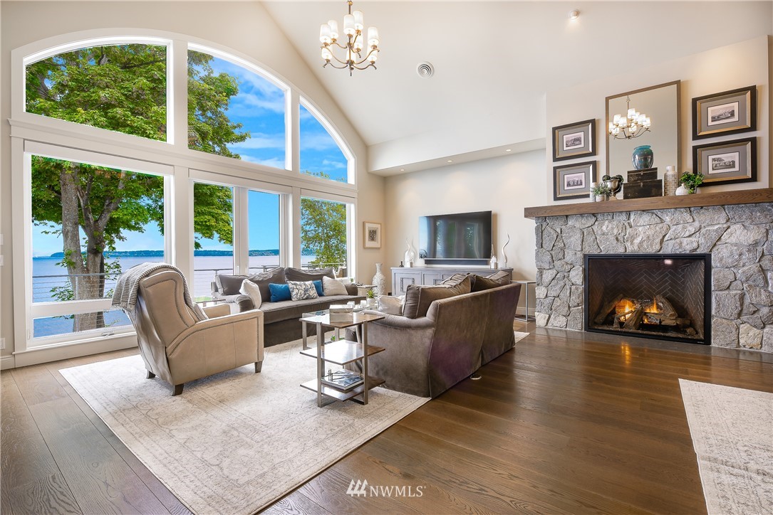 8745 Oertel Drive Blaine, WA 98230 - Photo 6 of 40 a living room with furniture a large window and a fireplace