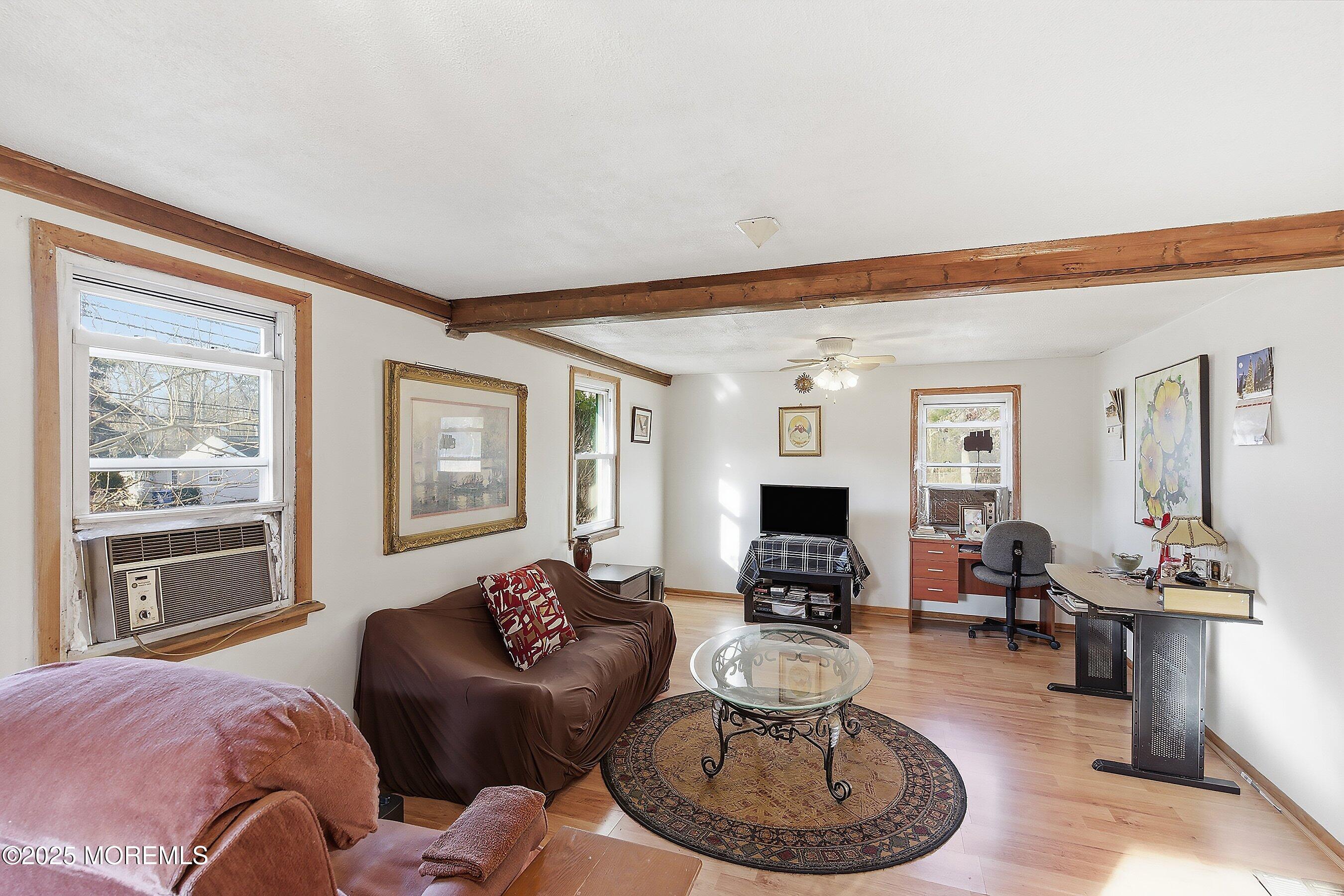 491 Lakehurst Road Browns Mills, NJ 08015 - Photo 4 of 15 a living room with furniture and a fireplace