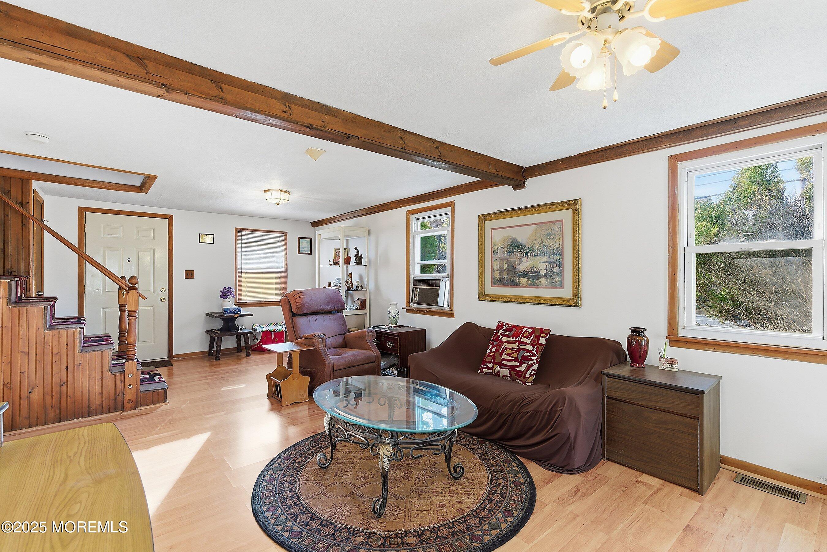 491 Lakehurst Road Browns Mills, NJ 08015 - Photo 5 of 15 a living room with furniture and a large window