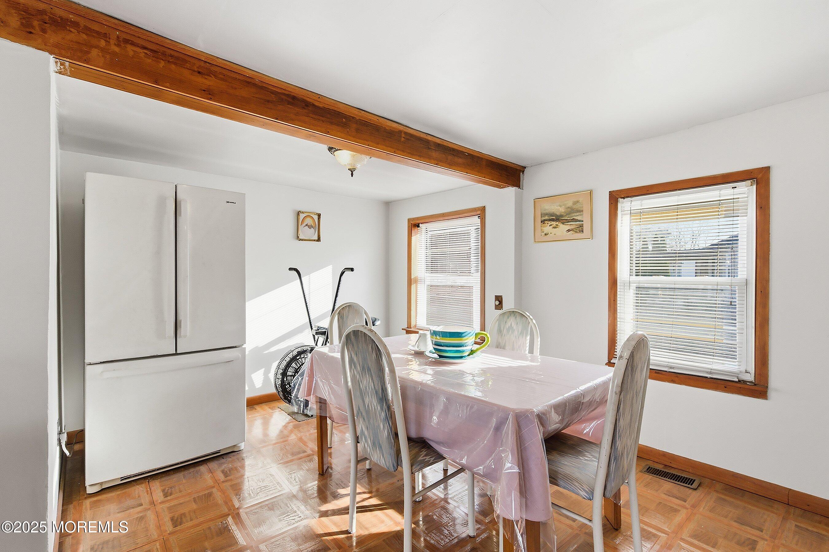 491 Lakehurst Road Browns Mills, NJ 08015 - Photo 9 of 15 a view of a dining room with furniture and a window