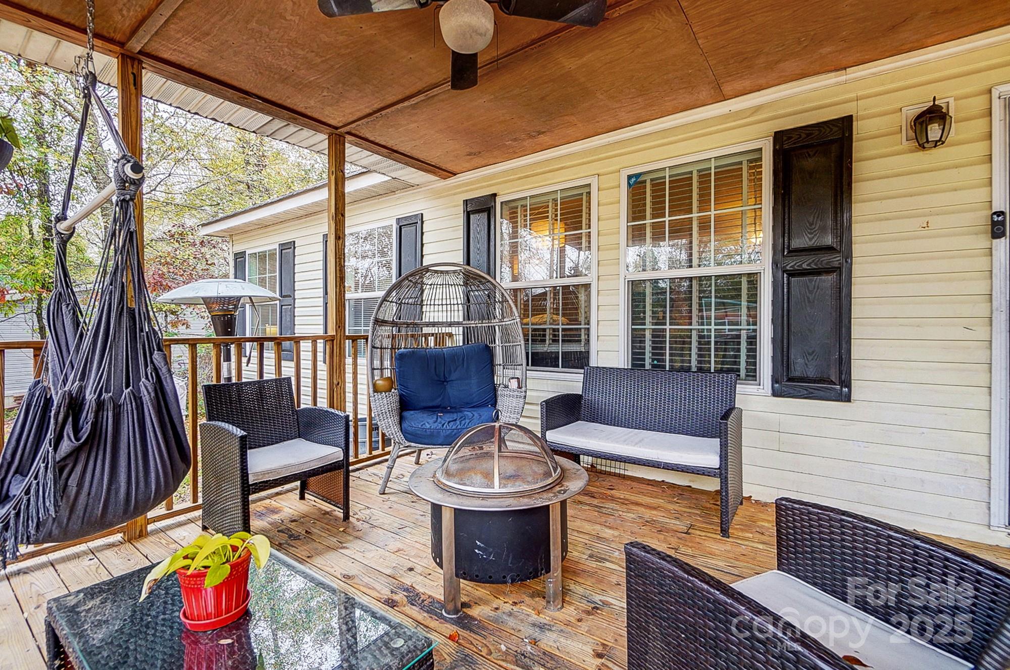 4450 Dobys Bridge Road Fort Mill, SC 29707 - Photo 8 of 45 a view of a patio with couches chairs and potted plants