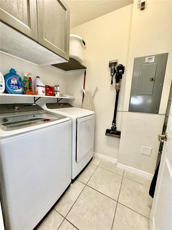 2208 Gopher Tortoise Terrace Oakland, FL 34787 - Photo 15 of 50 a utility room with dryer and washer
