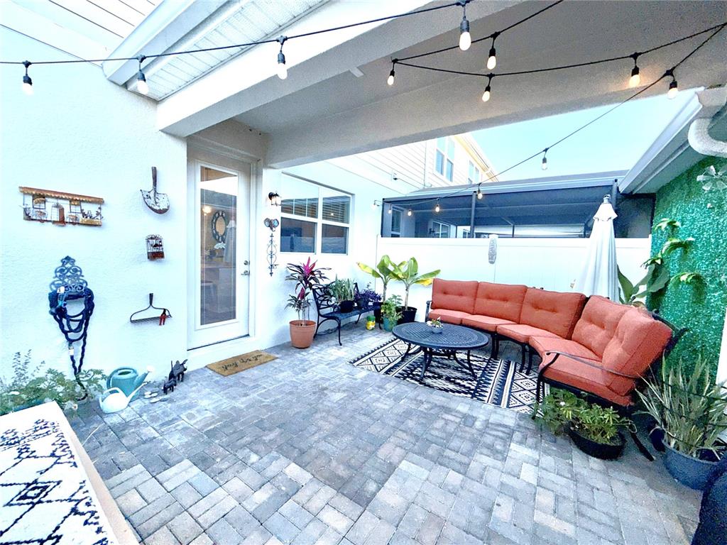 2208 Gopher Tortoise Terrace Oakland, FL 34787 - Photo 17 of 50 a outdoor space with lots of chairs and potted plants