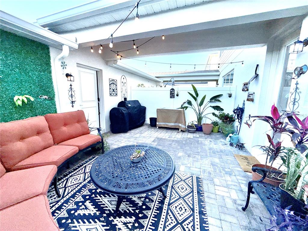 2208 Gopher Tortoise Terrace Oakland, FL 34787 - Photo 18 of 50 a living room with furniture and a chandelier